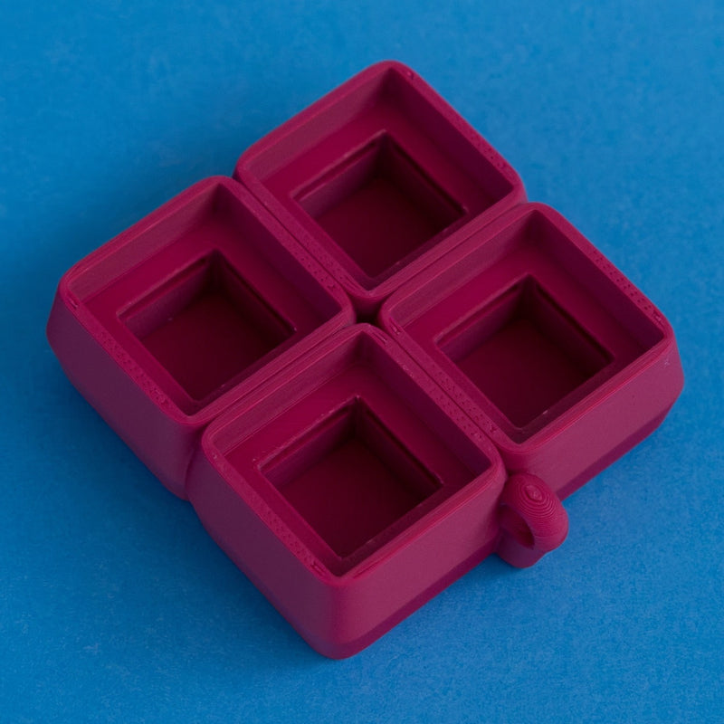 Plum four slot keycap clicker base empty rear three quarter view.