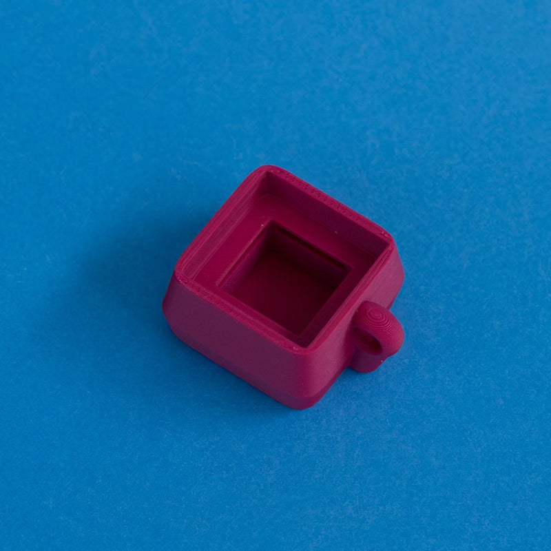 Plum keycap clicker base empty side view.