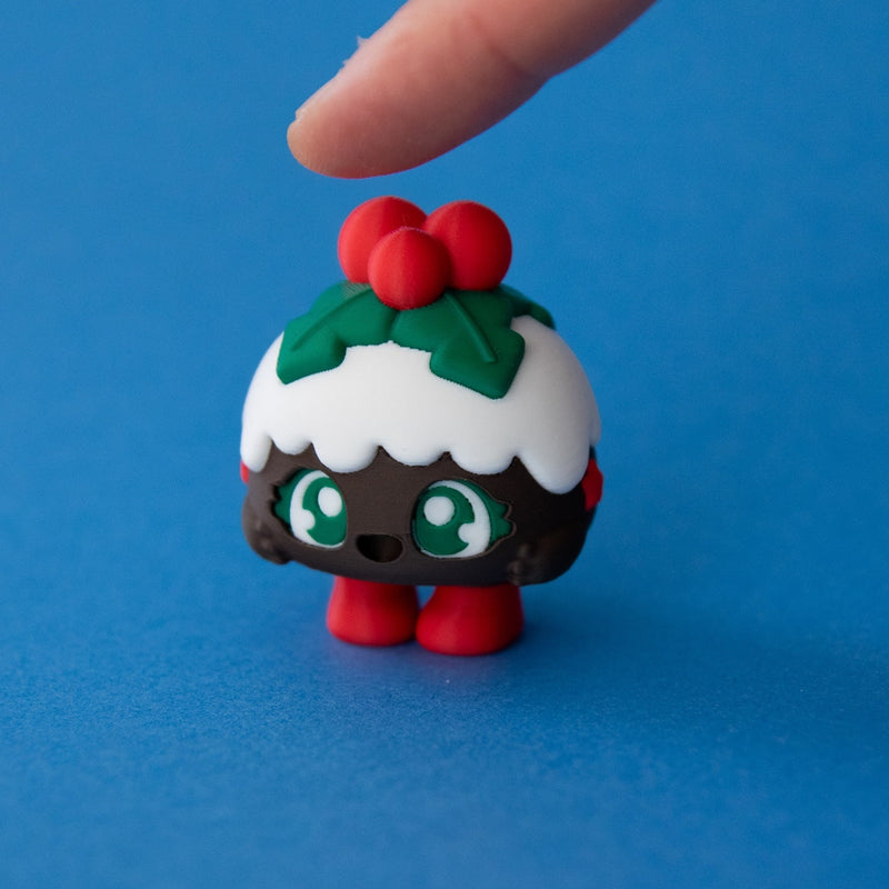 Plum the Christmas Pudding Clicker released on a blue background