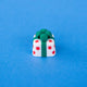 Polka the spotted present keycap, white with red spots and a green bow, front view