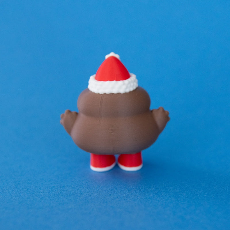 Poopie the Christmas Clicker rear view on a blue background