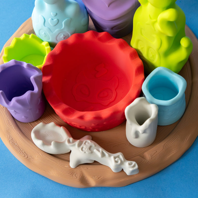 Close-up of the green, purple, blue and candle cups around the mixing bowl