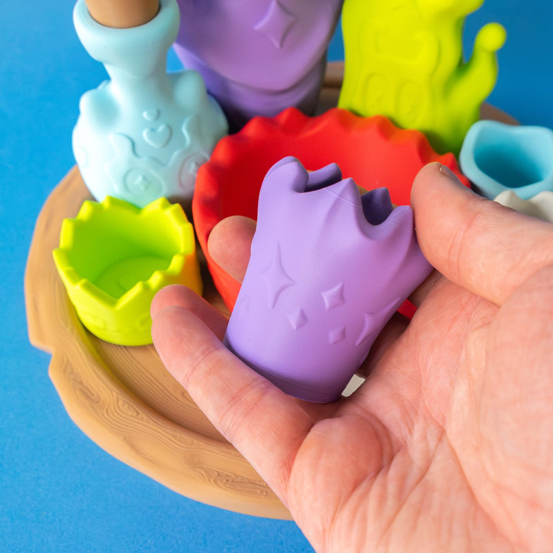 Purple witch cup from the Potion Kit held in hand
