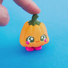 Posie the Pumpkin Clicker pressed three times at the stem, showing the pumpkin top dip and spring back.