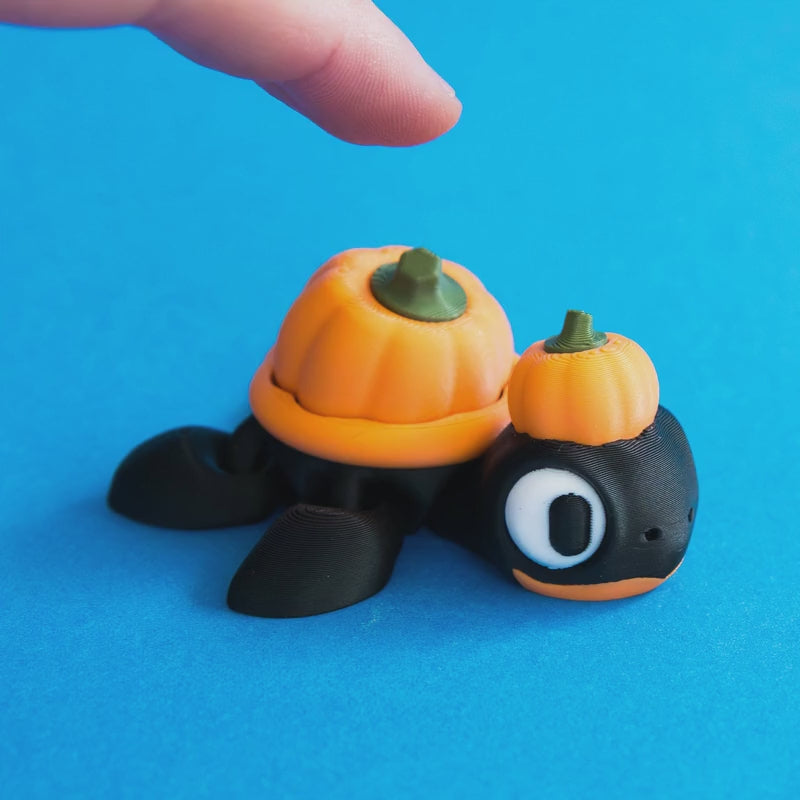 Gourdon the Pumpkin Turtle Clicker demonstrating the released and pressed pumpkin shell.
