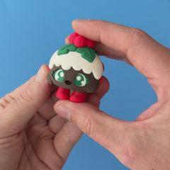 Plum the Christmas Pudding Clicker pressed and released, with the original mechanical click sound