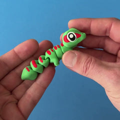 Ash the Madagascar Gecko 3D printed fidget wiggling in hand