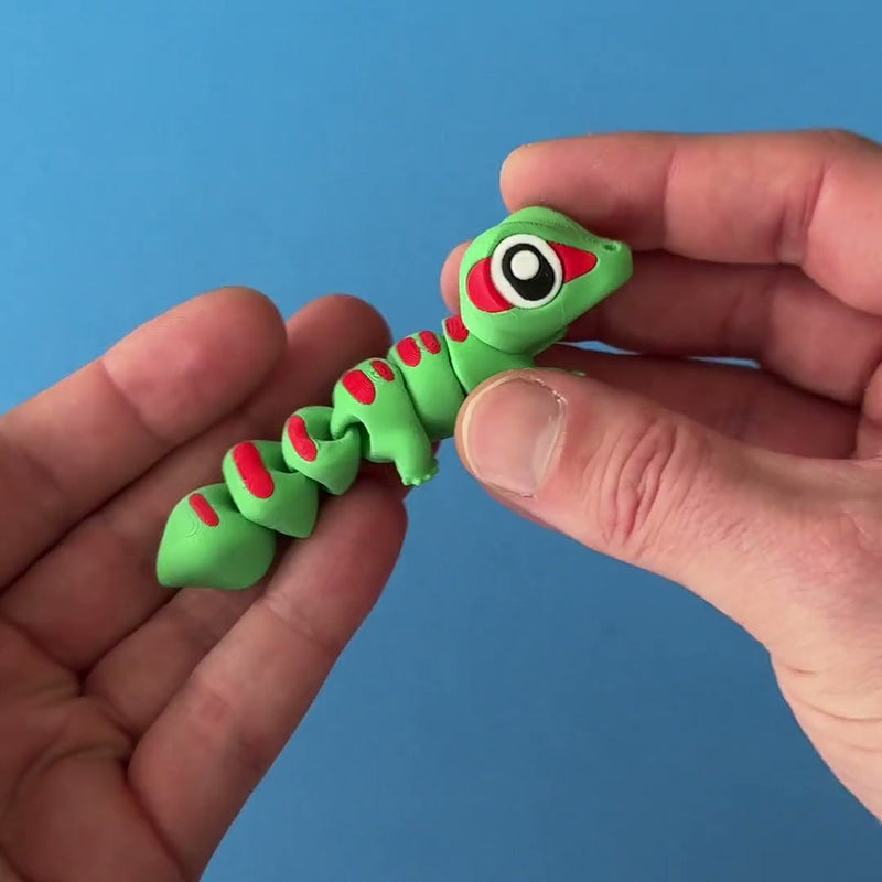 Ash the Madagascar Gecko 3D printed fidget wiggling in hand