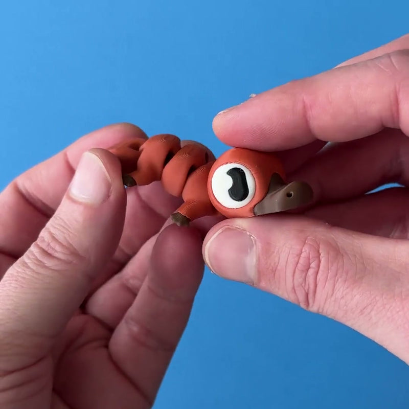 Bibble the Platypus 3D printed fidget wiggling in hand