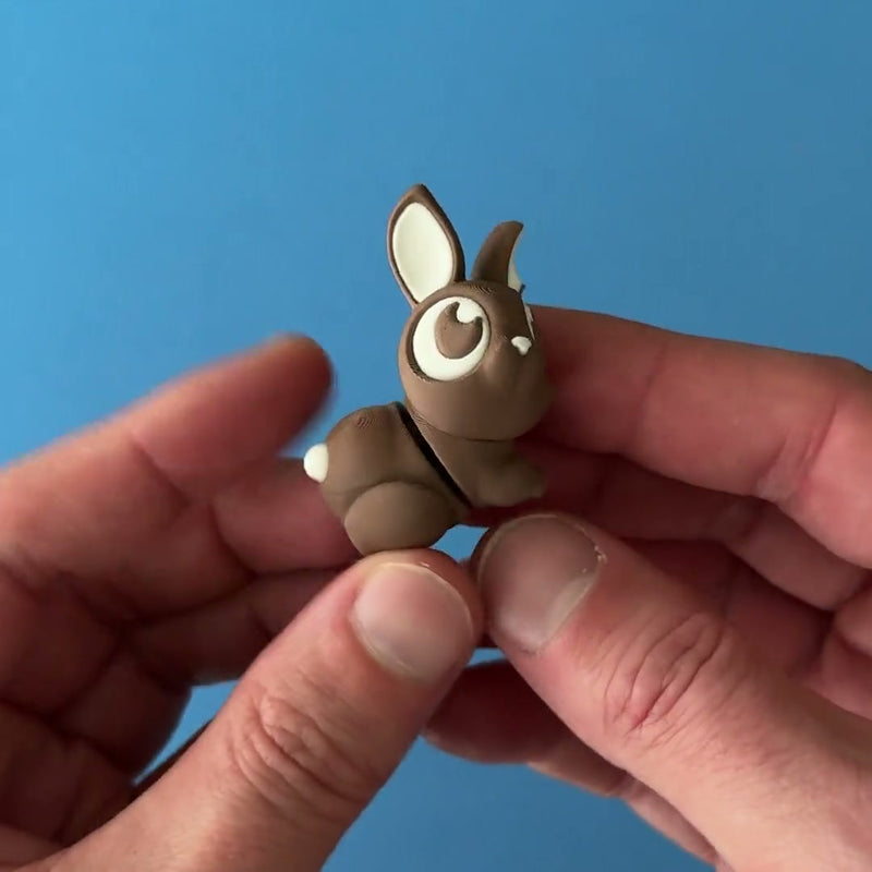 Bonbon the Bitten Bunny 3D printed fidget wiggling in hand