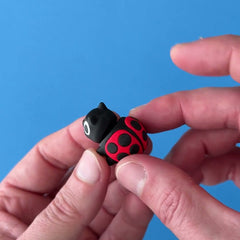 Clover the Ladybug 3D printed fidget wiggling in hand
