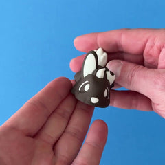 Cocoa the Chocolate Bunny Chonk Dragon 3D printed fidget wiggling in hand