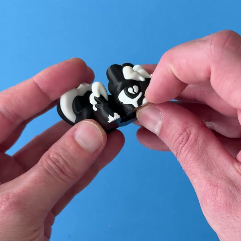 Cuddlebug the Heartbroken Babychonk 3D printed fidget wiggling in hand