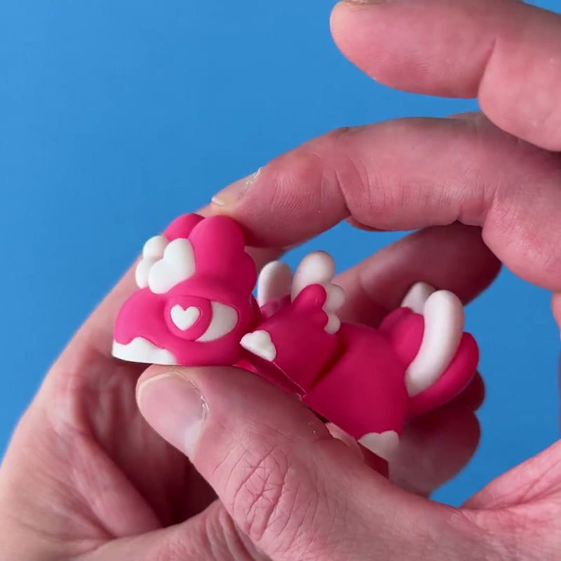 Cuddlebug the Sweetheart Babychonk 3D printed fidget wiggling in hand