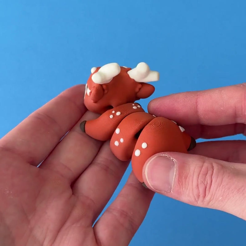 Dash the Reindeer Dragon 3D printed fidget wiggling in hand