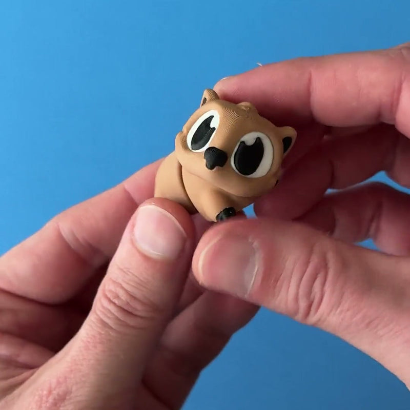 Doug the Wombat 3D printed fidget wiggling in hand