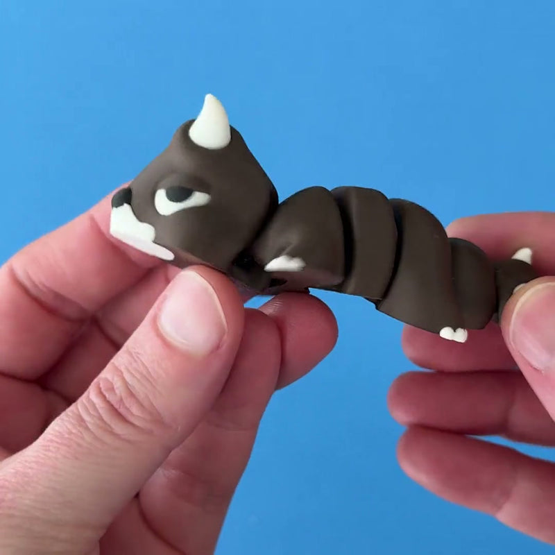 Dozer the Bull Chonk Dragon 3D printed fidget wiggling in hand