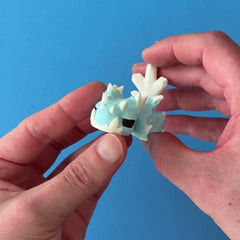 Drift the Snowflake Dragon 3D printed fidget wiggling in hand