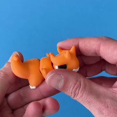 Ember the Chonk Dragon 3D printed fidget wiggling in hand