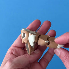 Evonk the Fanchonk Dragon 3D printed fidget wiggling in hand