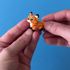 Fenn the Fox Sidekick 3D printed fidget wiggling in hand