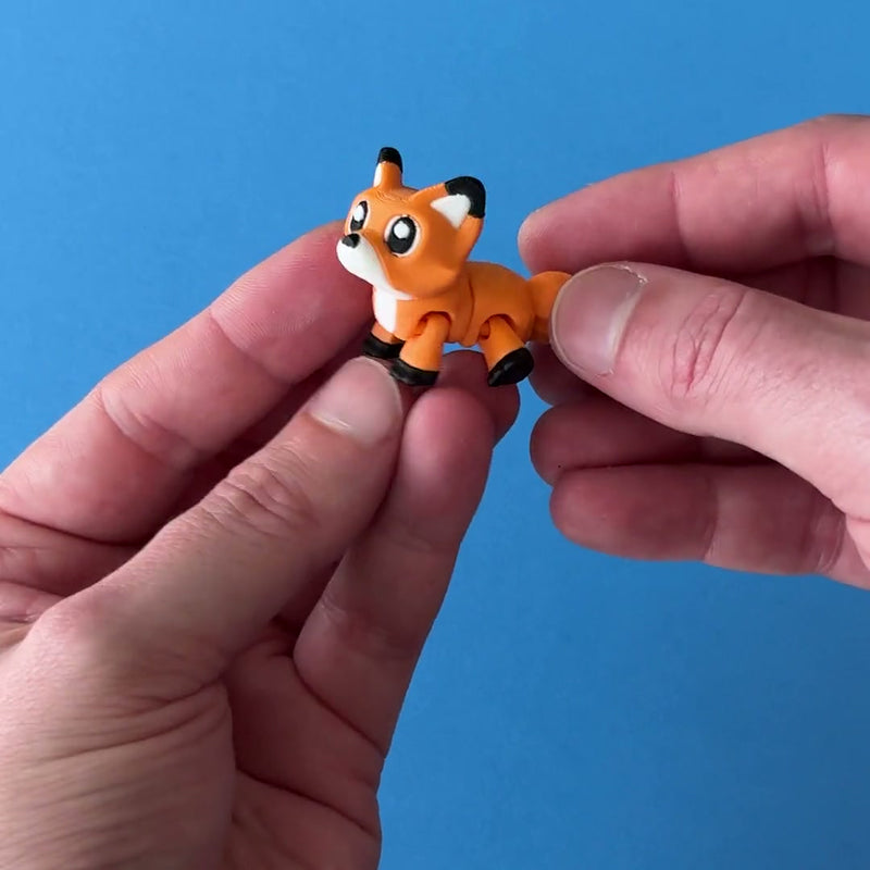 Fenn the Fox Sidekick 3D printed fidget wiggling in hand