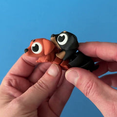 Frankie & Noodle the Dachshunds 3D printed fidget wiggling in hand