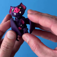 Gloomble the Vampire Bat 3D printed fidget wiggling in hand