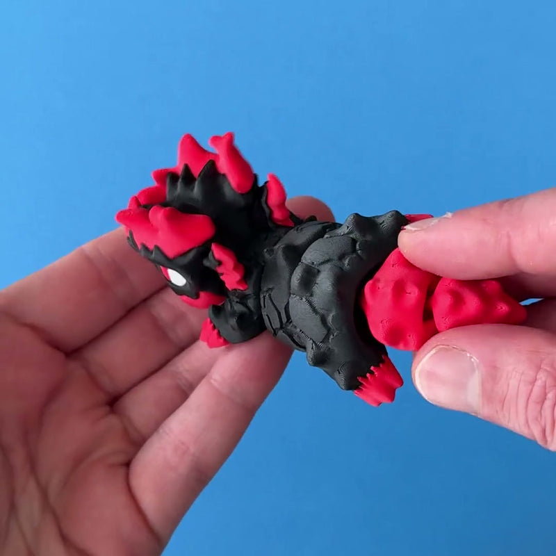 Gritt the Lava Chonk 3D printed fidget wiggling in hand