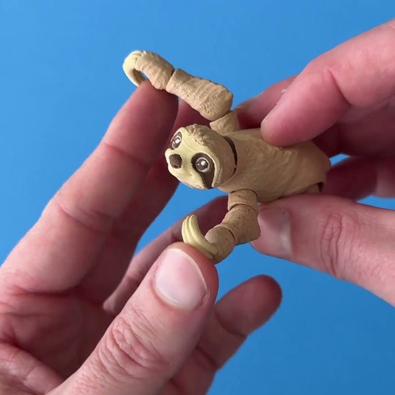 Hugo the Hanging Out Sloth 3D printed fidget wiggling in hand