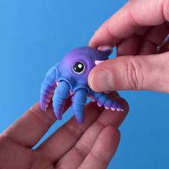 Inky Dinky the Wiggly Octopus 3D printed fidget wiggling in hand