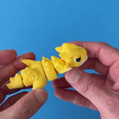 Jolt the Chonk Dragon 3D printed fidget wiggling in hand