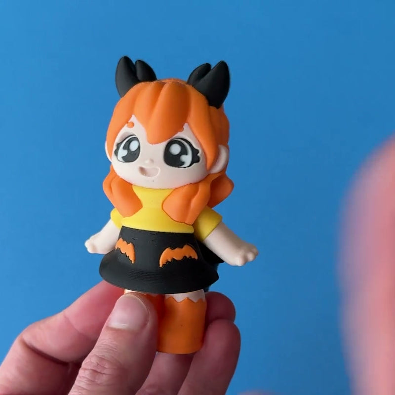 Kandi the Scorpio Girl 3D printed fidget wiggling in hand