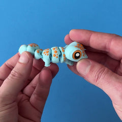 Koa the Tokay Gecko 3D printed fidget wiggling in hand