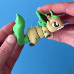 Leef the Fanchonk Dragon 3D printed fidget wiggling in hand