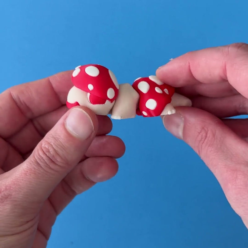 Mimi the Mushroom Babychonk 3D printed fidget wiggling in hand