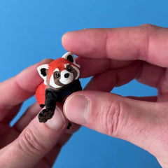Momo the Red Panda 3D printed fidget wiggling in hand
