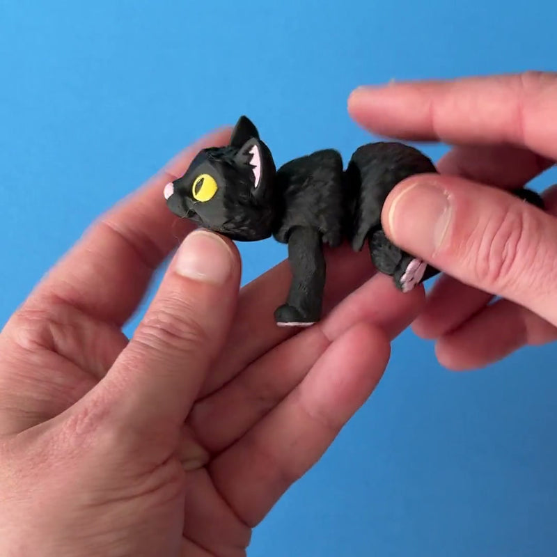 Moonlight the Black Cat 3D printed fidget wiggling in hand