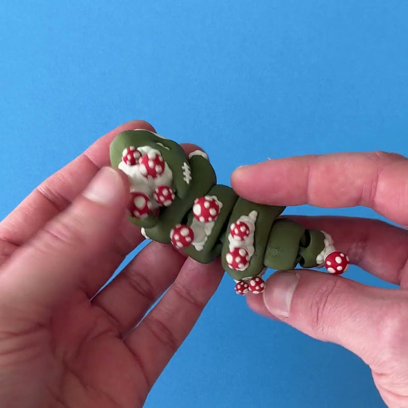 Mort the Sporewalker Zombie Dragon 3D printed fidget wiggling in hand