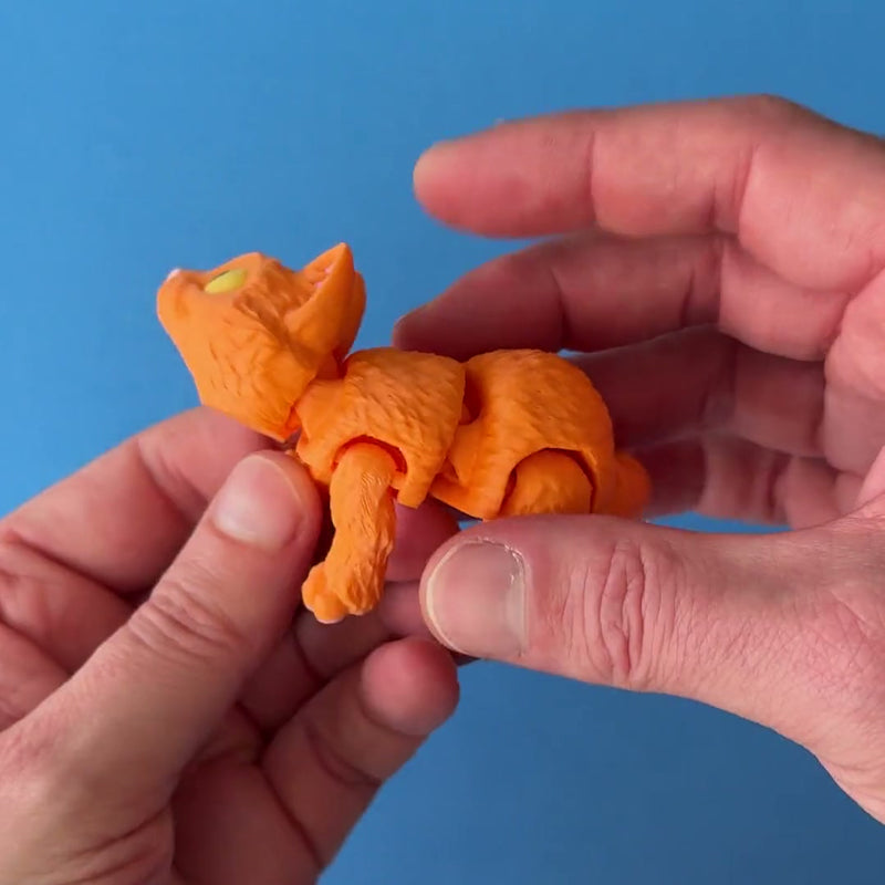Mush the Orange Cat 3D printed fidget wiggling in hand