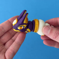 Nubi the Pharaoh Chonk 3D printed fidget wiggling in hand