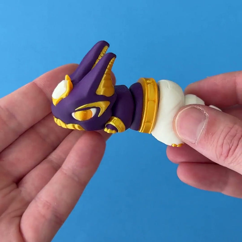 Nubi the Pharaoh Chonk 3D printed fidget wiggling in hand