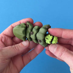Oke the Mosswood Sprig Variant 3D printed fidget wiggling in hand