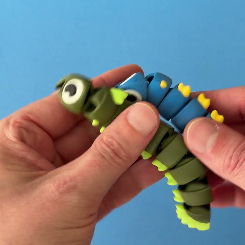 Ribbon the Eel 3D printed fidget wiggling in hand