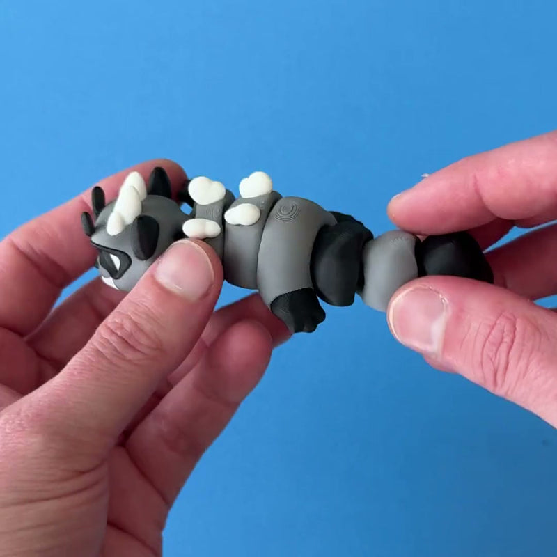 Riff the Raccoon Beast Dragon 3D printed fidget wiggling in hand
