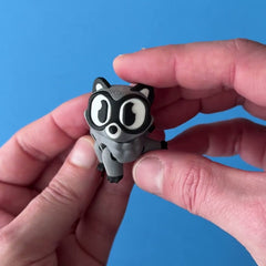 Rilo the Raccoon 3D printed fidget wiggling in hand