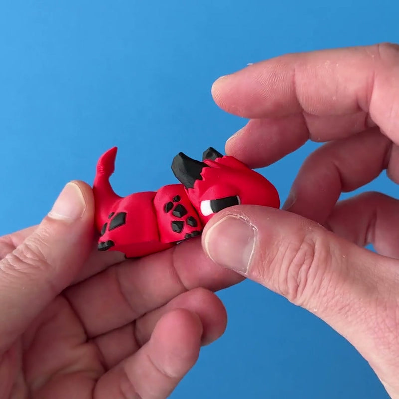Scorch the Imp Chonk Dragon 3D printed fidget wiggling in hand