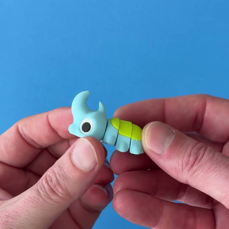 Spike the Horned Beetle 3D printed fidget wiggling in hand