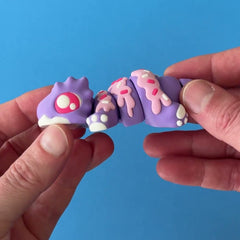 Sprink the Dragon 3D printed fidget wiggling in hand
