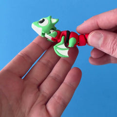 Tinsel the Elf Dragon 3D printed fidget wiggling in hand